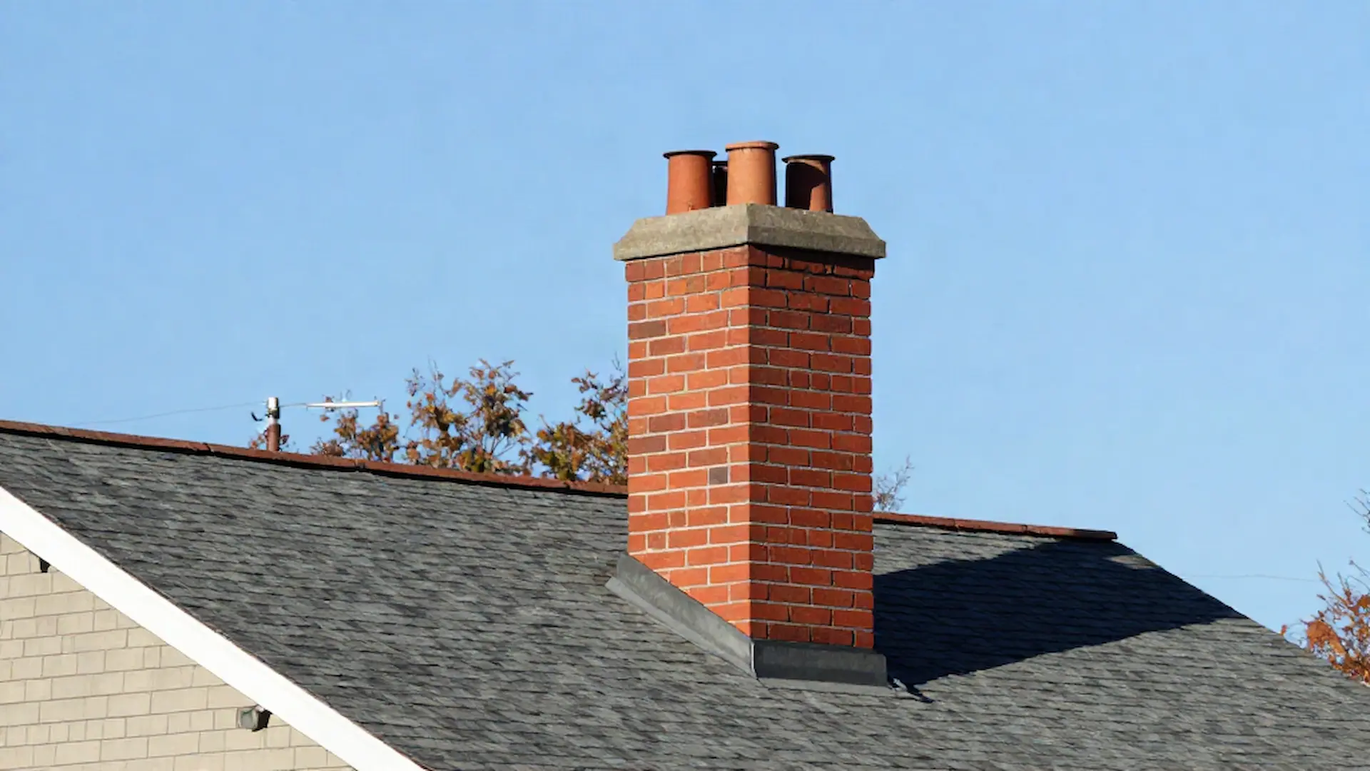 Brick chimney on a home served by 3 Bros Chimney Care in Washington, DC